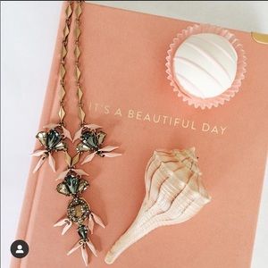 Ornate gold tone crystal pendant necklace